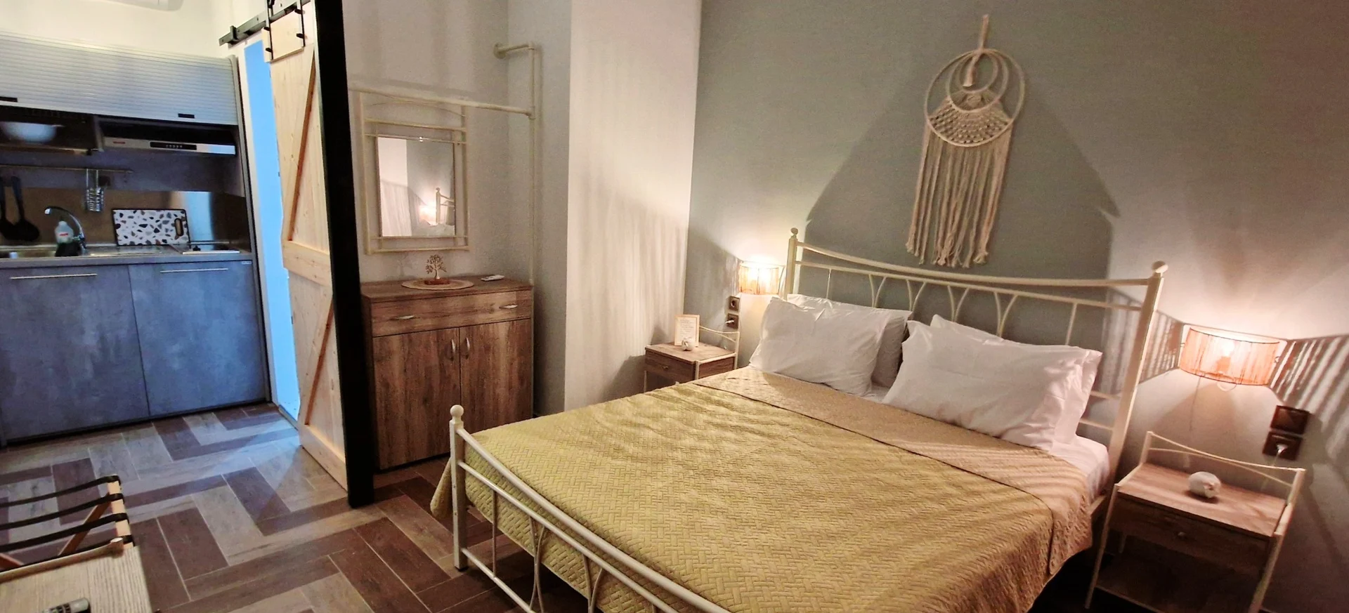 Double bed and kitchen area